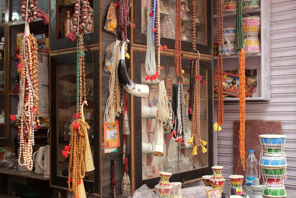 A shop in Varanasi with japa malas and prayer beads hanging for sale