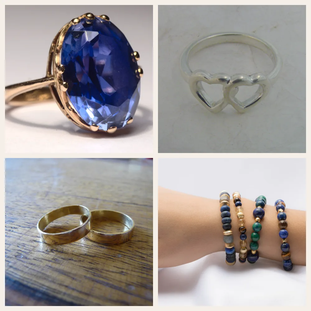 An arrangement of a sapphire ring, a silver heart ring, two gold bands and round-bead stone bracelets