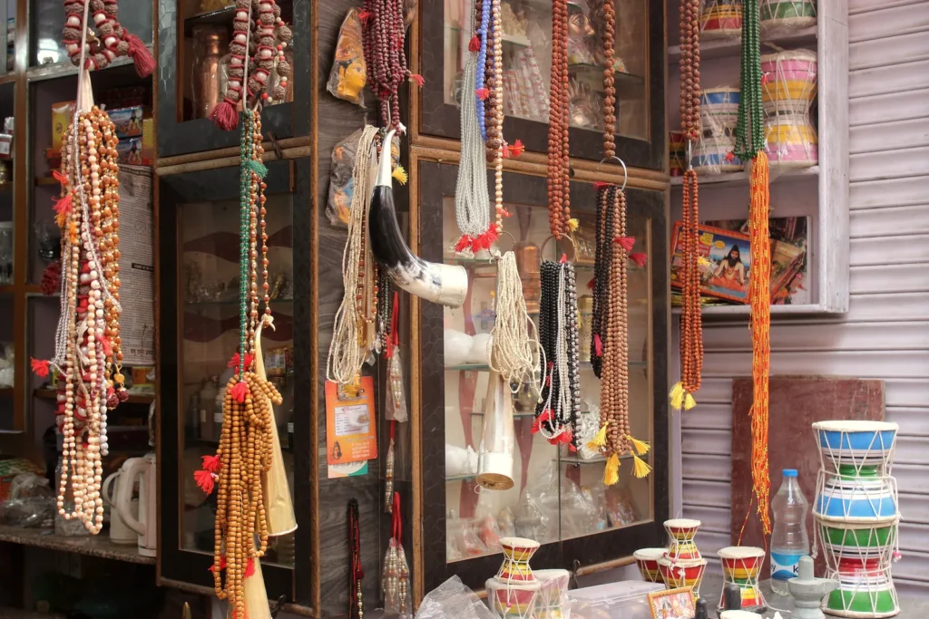 A shop in Varanasi with japa malas and prayer beads hanging for sale